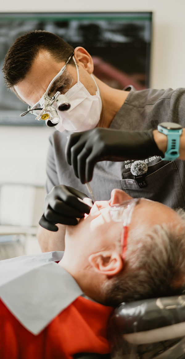Dr Daniel Hargitai explaining the dental implant process