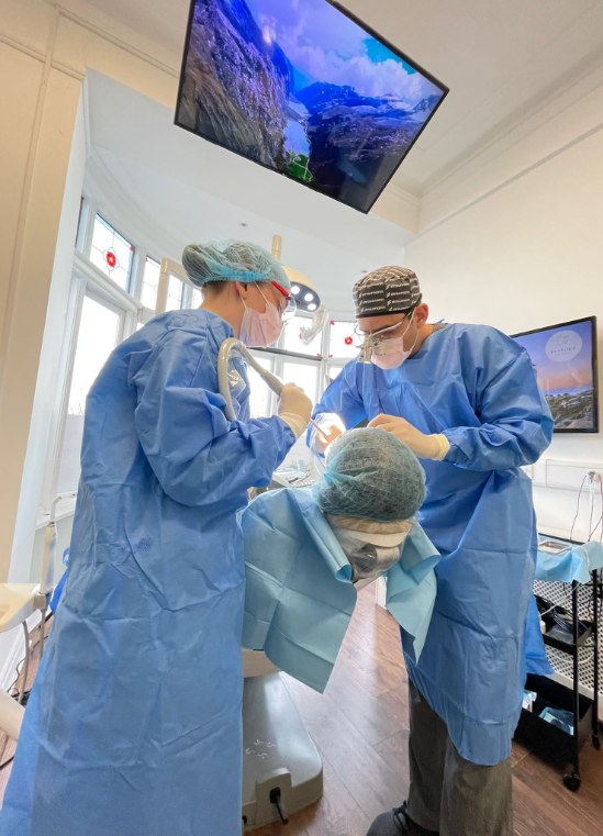 Dr Daniel Hargitai and his team performing implant surgery at Bespoke Dental